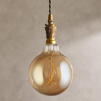 Extra Large globe 4 watt irregular filament LED bulb with amber coating and B22 fitting