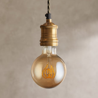 Large globe 4 watt LED edison style filament bulb with amber coating and E27 fitting