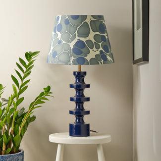 Spool table lamp in deep blue lacquered wood
