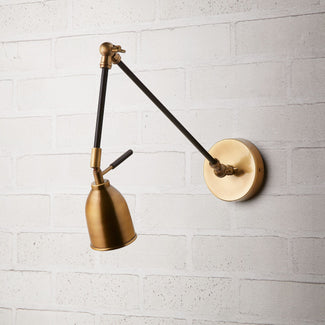Pick wall light in black and brass