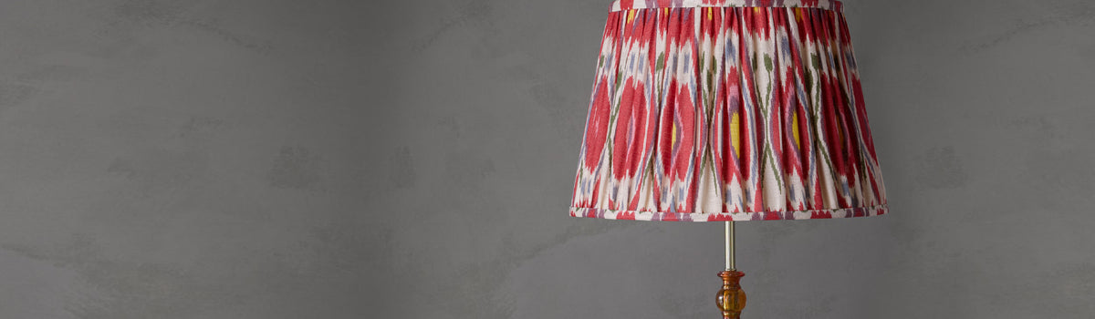 Pooky lampshades hero with an ikat shade on a brass lamp