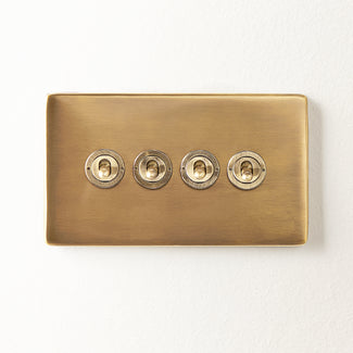 Four gang 2 way Florence toggle switch in brass