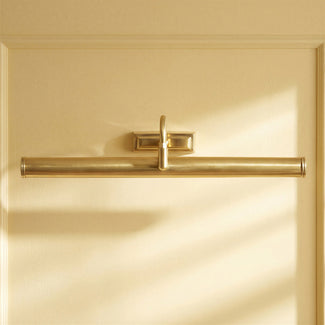 Larger Clyfford picture light in waxed antique brass