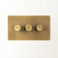 Lucian three gang dimmer switch in aged brass