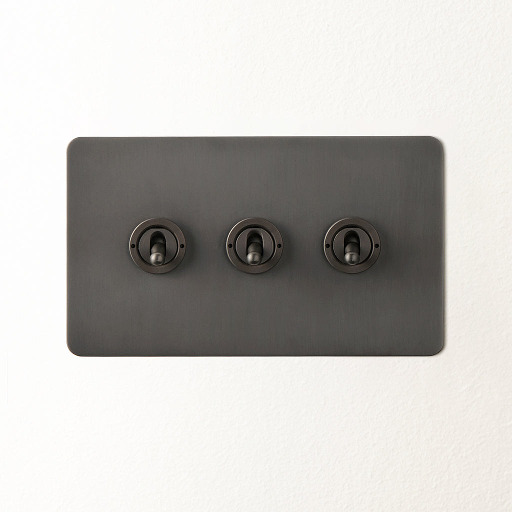Lucian three gang 2 way toggle switch in bronze