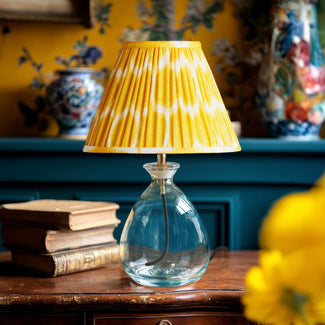 Smaller Wobble bottle table lamp in blue hammered glass