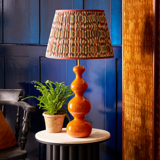 Smaller Wobster table lamp in burnt orange lacquered wood