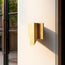 Andor IP54 fixed wall light in brass