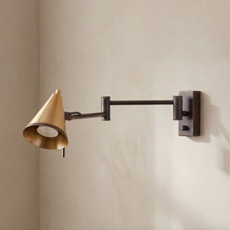 Conrad articulated wall light in bronze with brass hood
