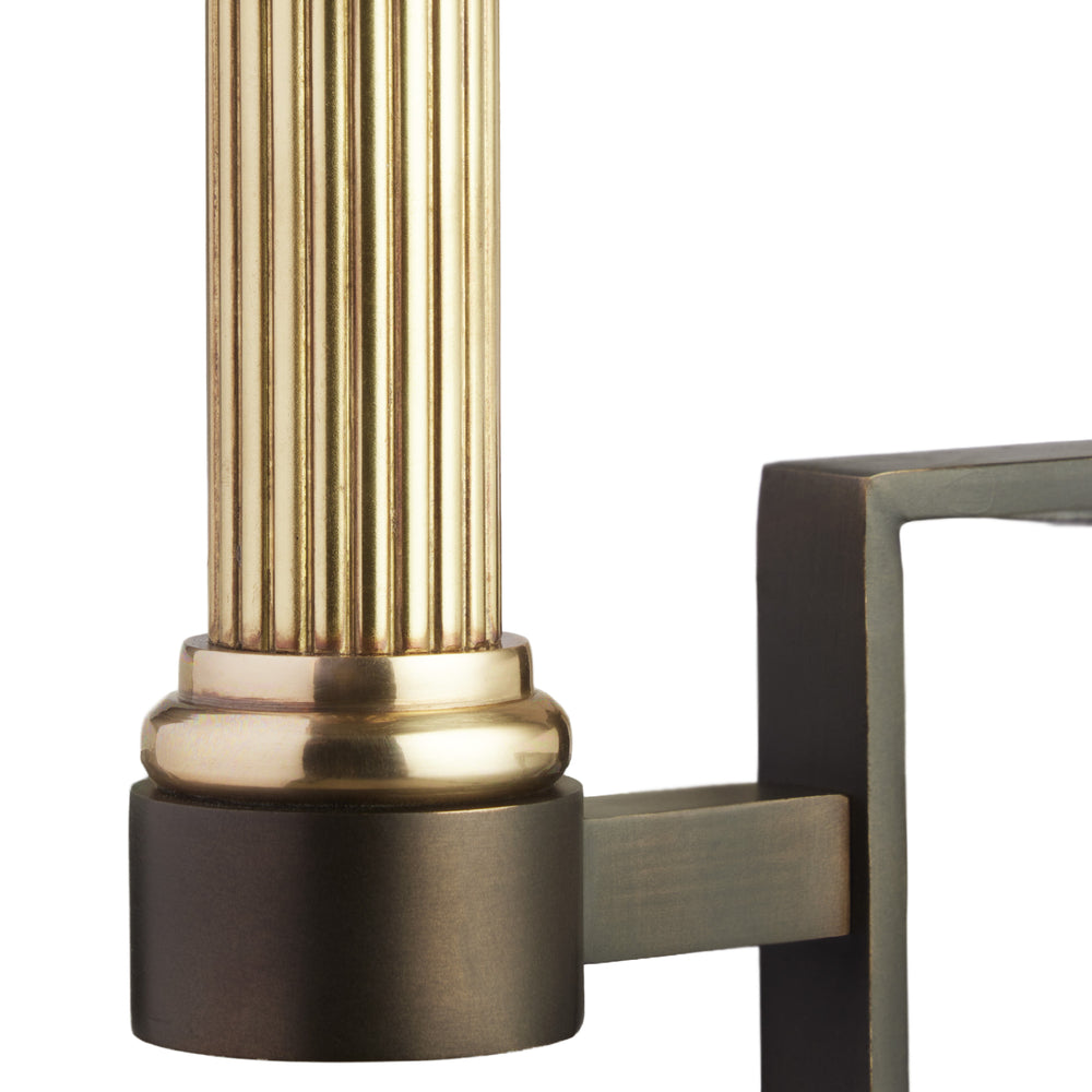 Brass bookshelf light clamped to a navy bookcase shelf