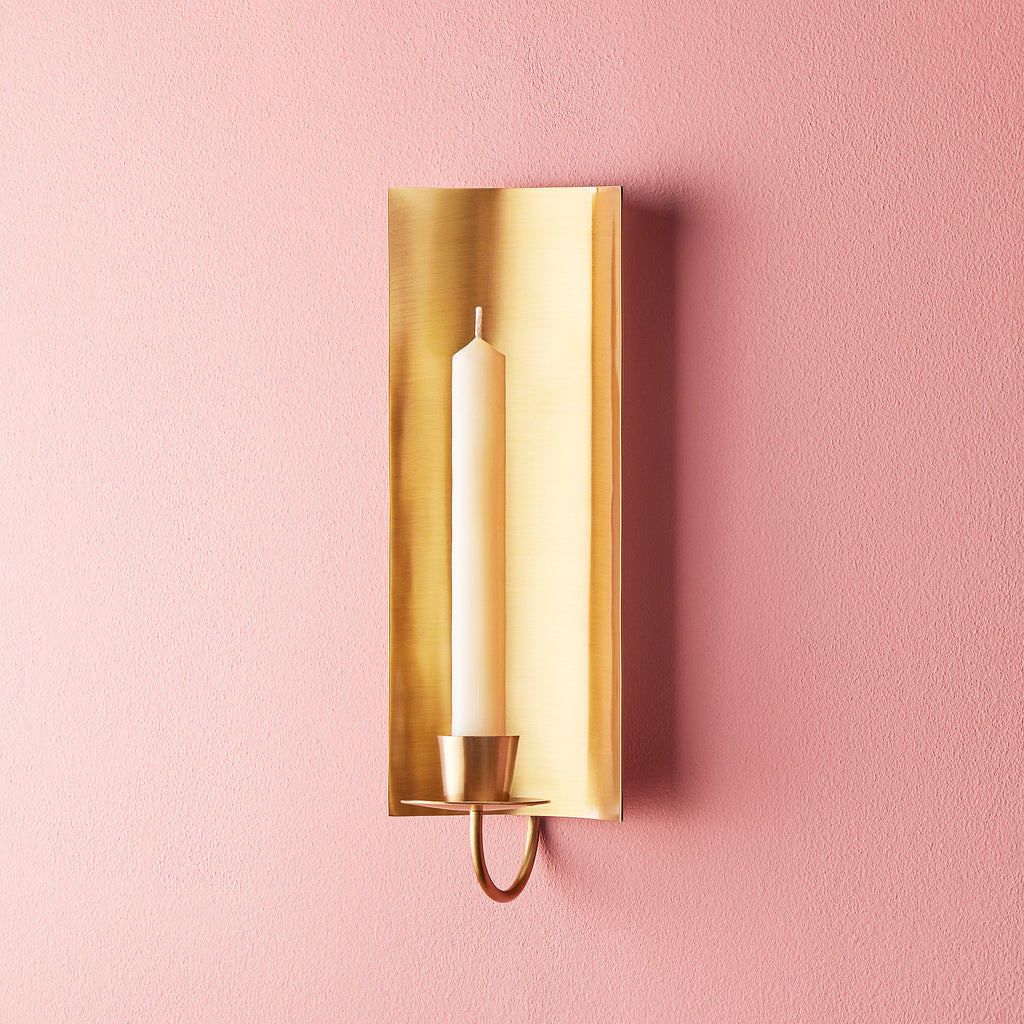 Pitti wall mounted candle holder in antiqued brass