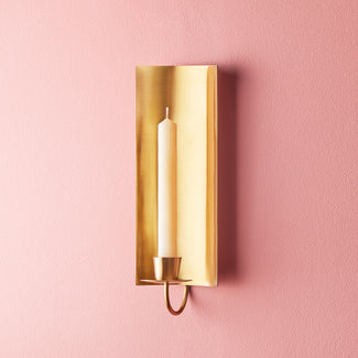 Pitti wall mounted candle holder in antiqued brass