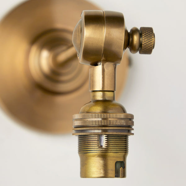 Elbow wall fitting in antiqued brass