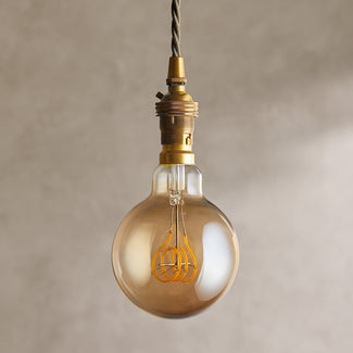 Large globe 4 watt LED edison style filament bulb with amber coating  and B22 fitting