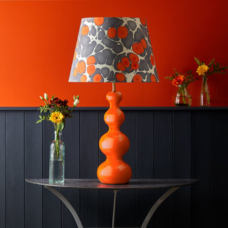 Smaller Wobster table lamp in orange lacquered wood