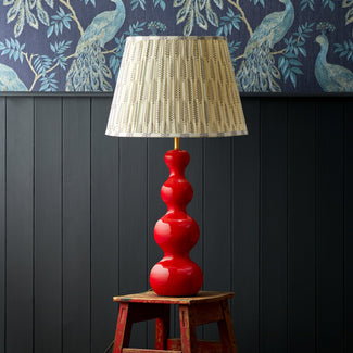Smaller Wobster table lamp in red lacquered wood