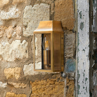 Crail IP44 exterior wall light in antique brass