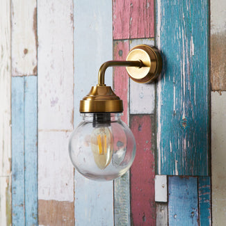 Davide IP44 wall light in antiqued brass and glass