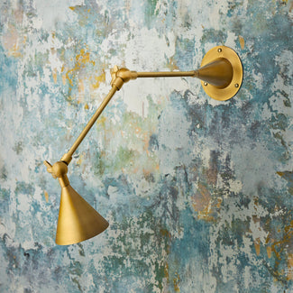 Egret wall light in antiqued brass