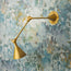Egret wall light in antiqued brass