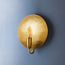 Moon wall light in antique brass