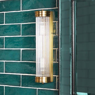 Long Roddy IP44 wall light in brass with glass rods