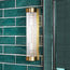Long Roddy IP44 wall light in brass with glass rods