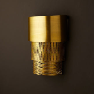 Schwink stepped wall sconce in antique brass finish