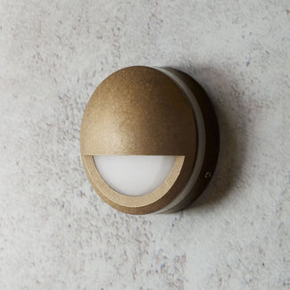 Thurlestone ip65 round wall light half cover in aged brass