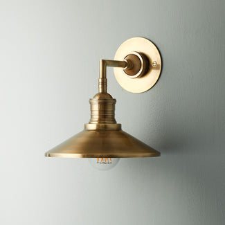 Whizzer wall light in antique brass
